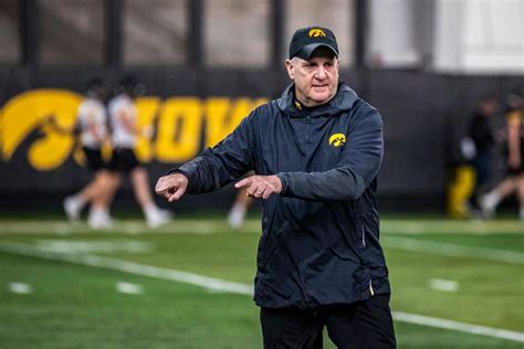 Most Iowa football assistant coaches receive pay .